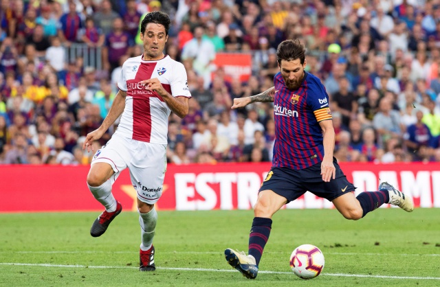 C Barcelona's Lionel Messi (R) in action against Huesca's Xabier Etxeita (L) during the Spanish La Liga soccer match between FC Barcelona and SD Huesca at Camp Nou in Barcelona, Spain, 02 September 2018.  EPA/MARTA PEREZ
