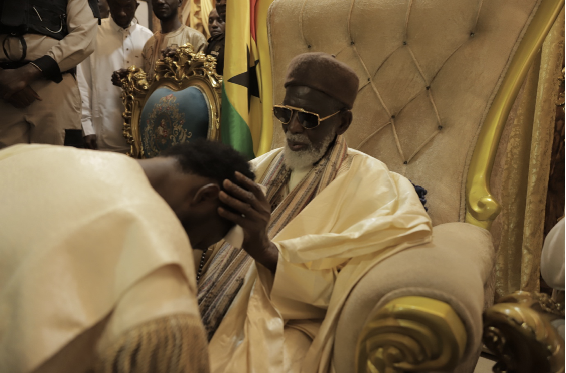 Chief Imam lays his hands on Nana Kwame Bediako as he prays, giving him his blessings and guidance foe the journey he’s embarked on.
